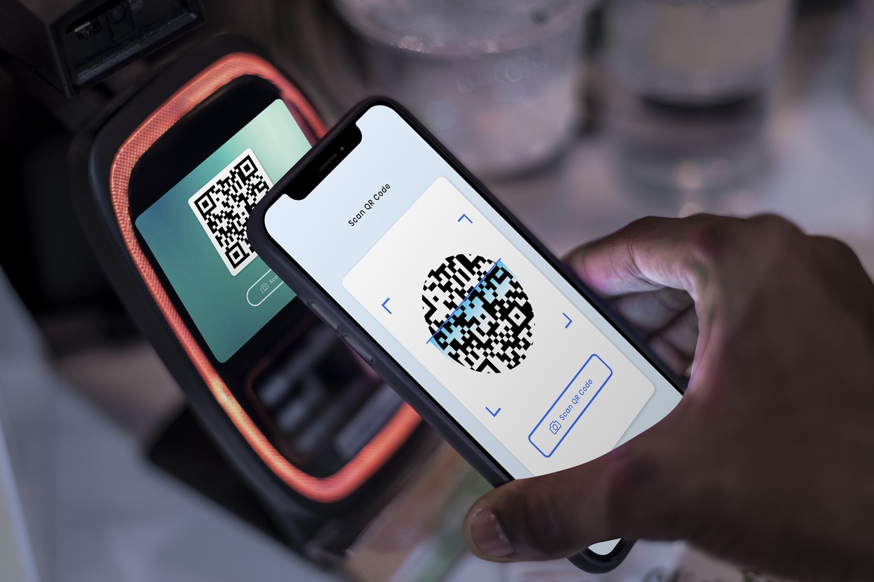 Customer paying at the POS with their mobile payment application
